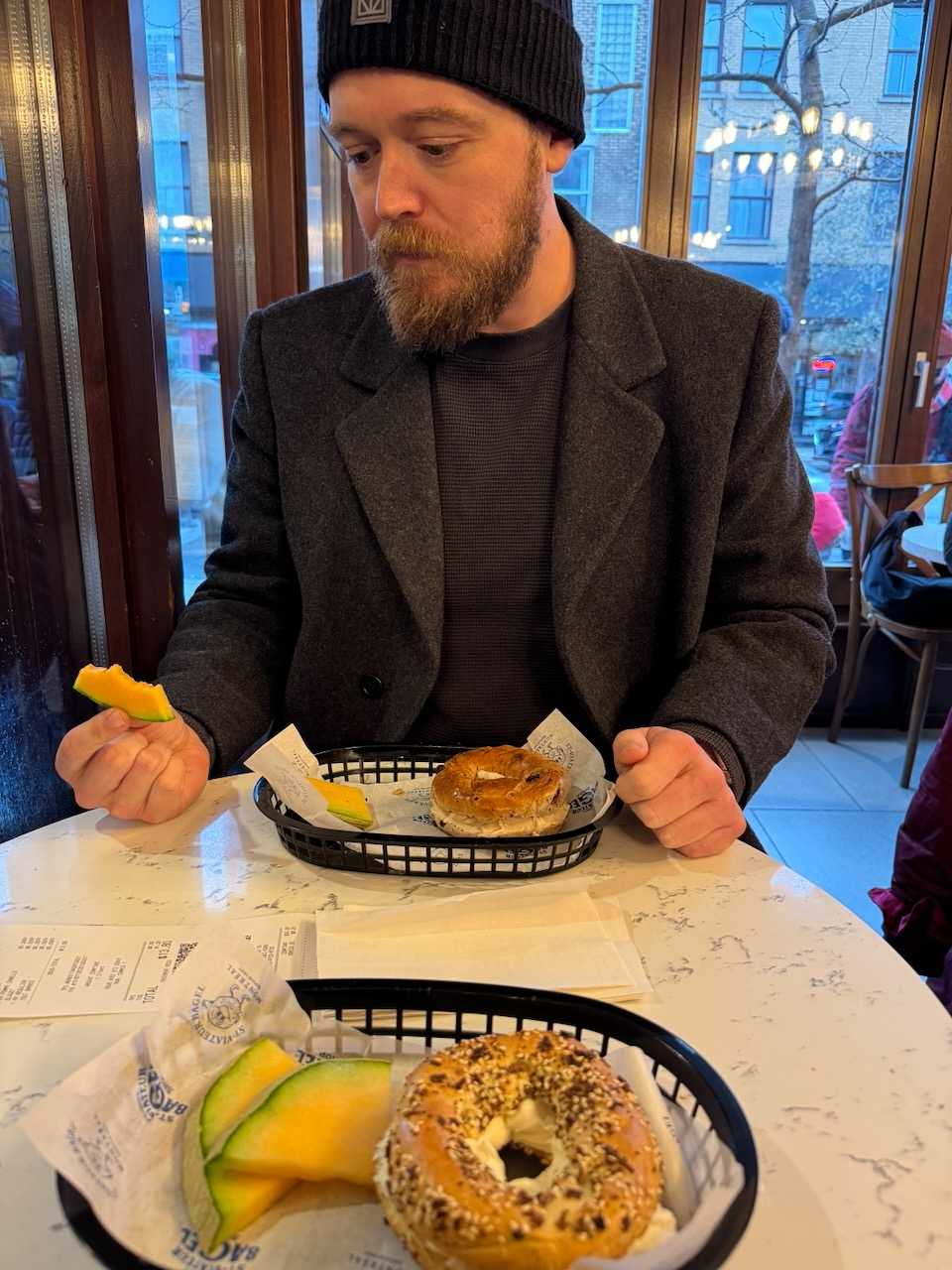 Having my first Montreal-style bagel. It was good in spite of what my face is saying