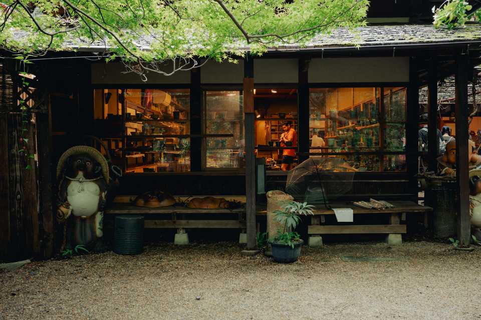 Shopping for ware featuring a tankui statue | Kyoto