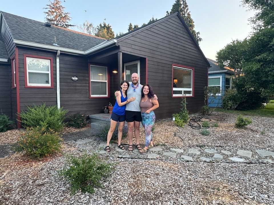 The 3 of us in front of the house