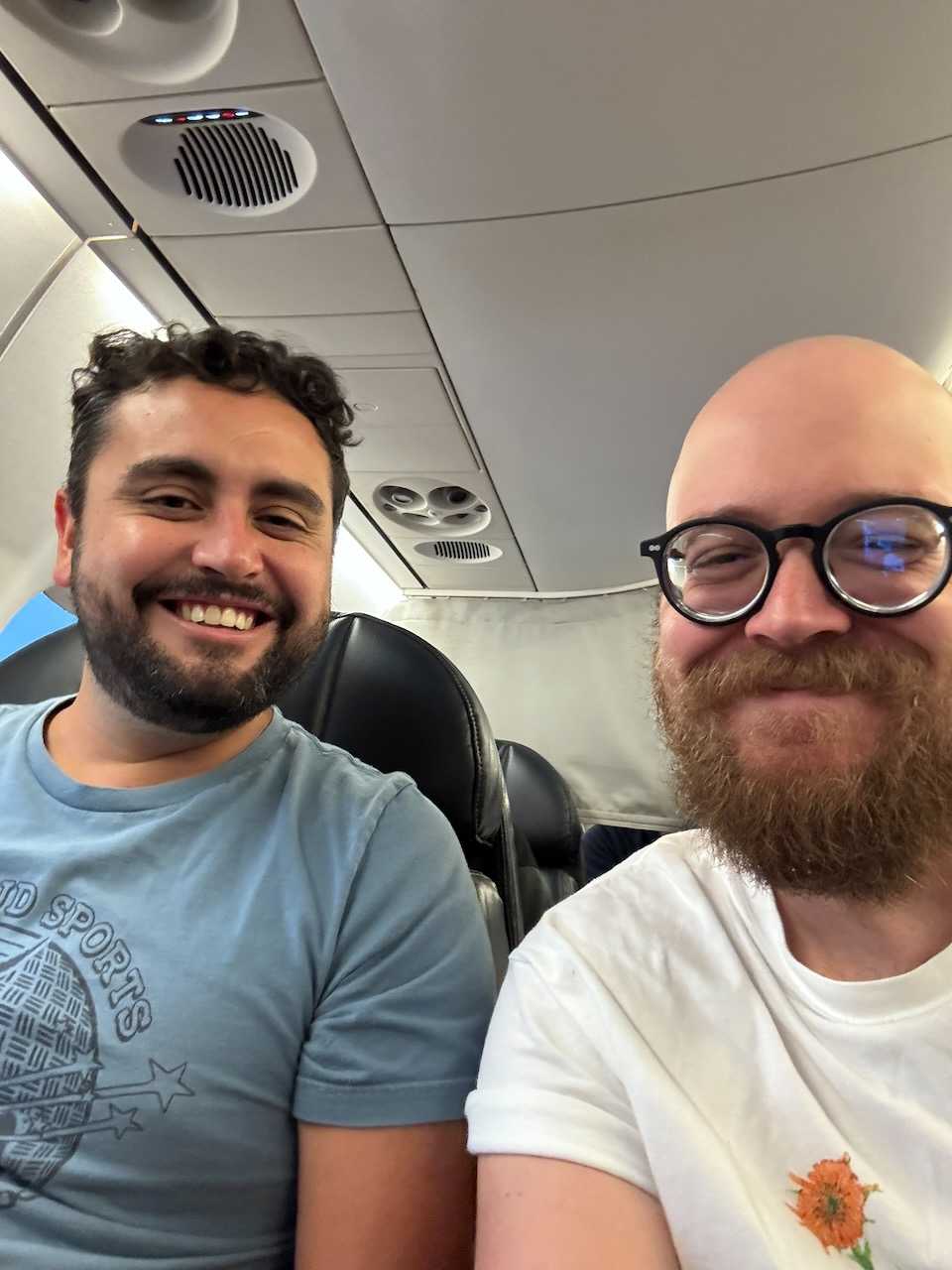 Charlie and I (with an insane beard) on the plan to SF