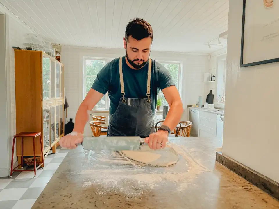 Charlie rolling out the dough